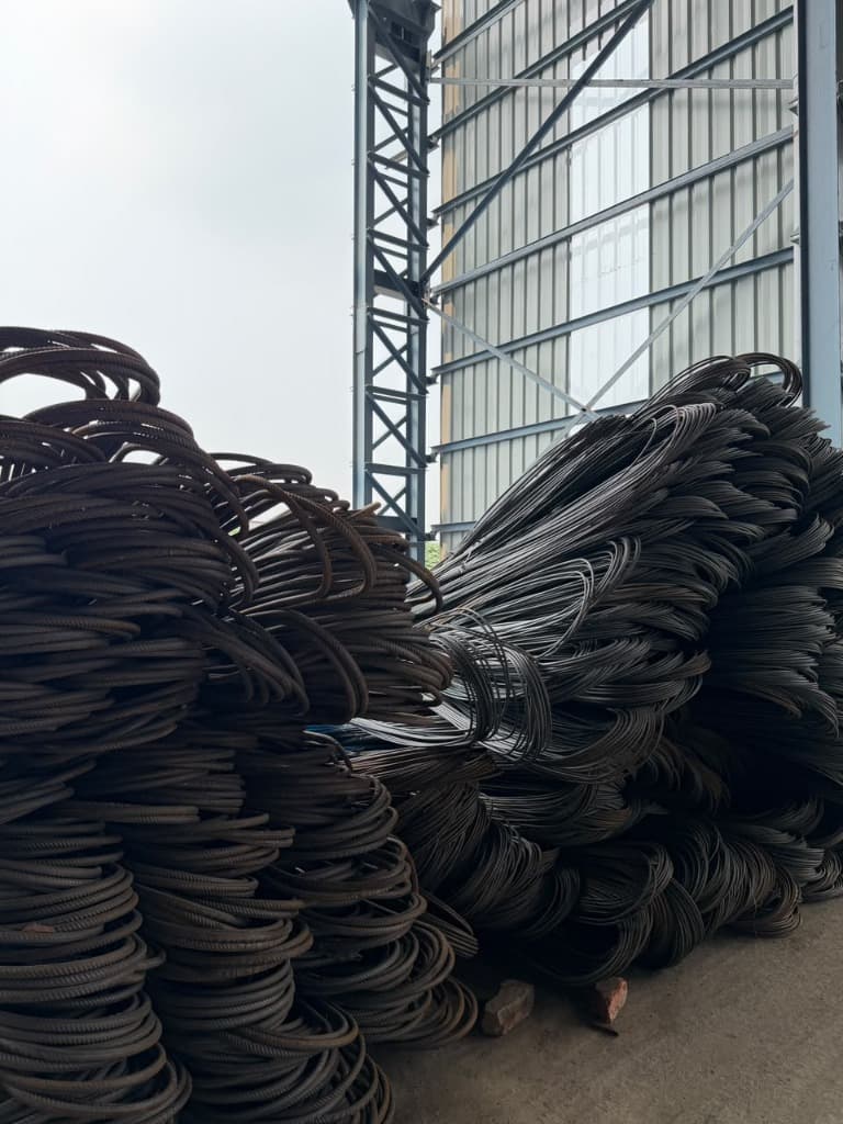 High-grade SAIL TMT coils under warehouse canopy